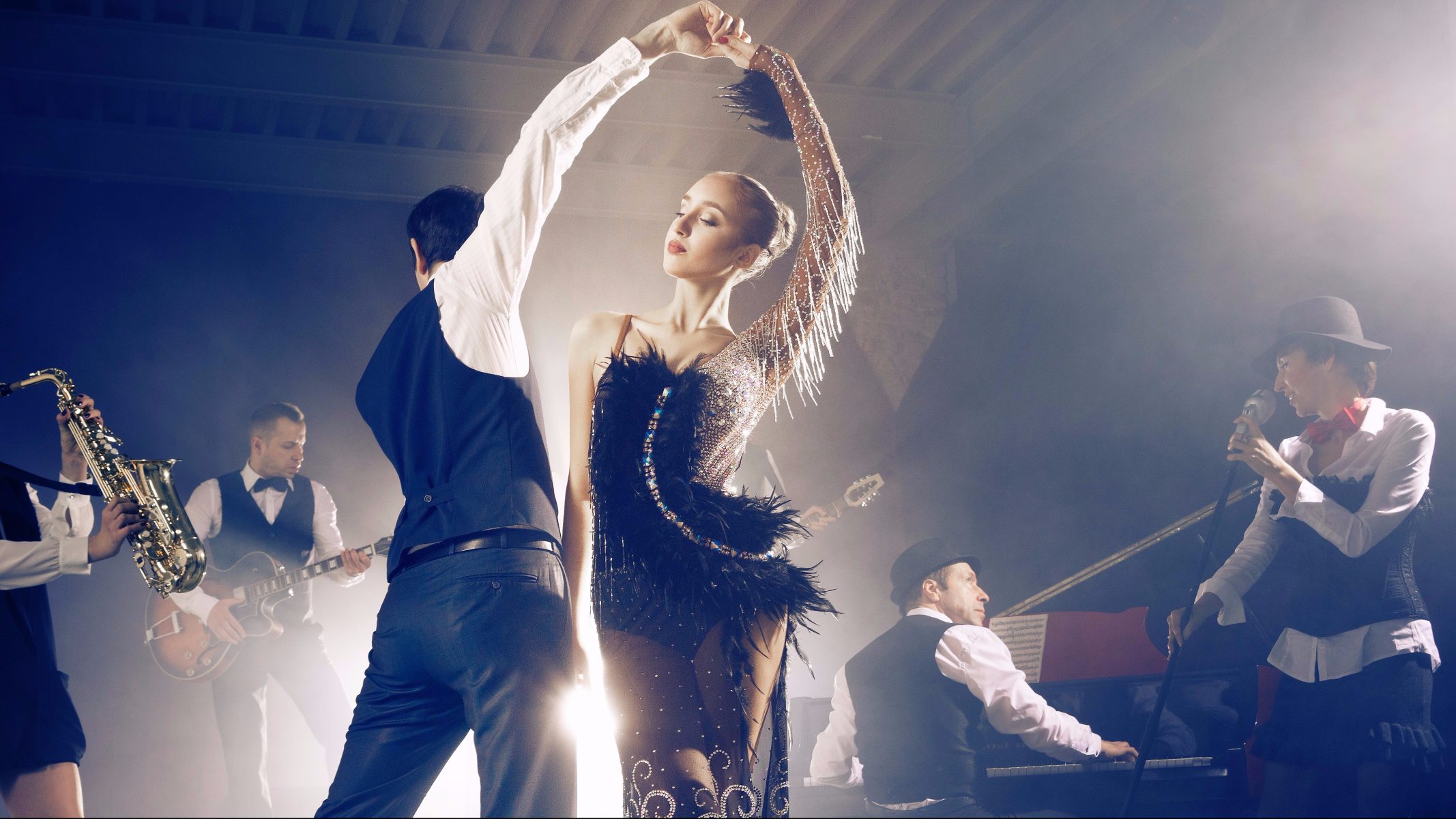 Dance couple dancing to a live band sounds